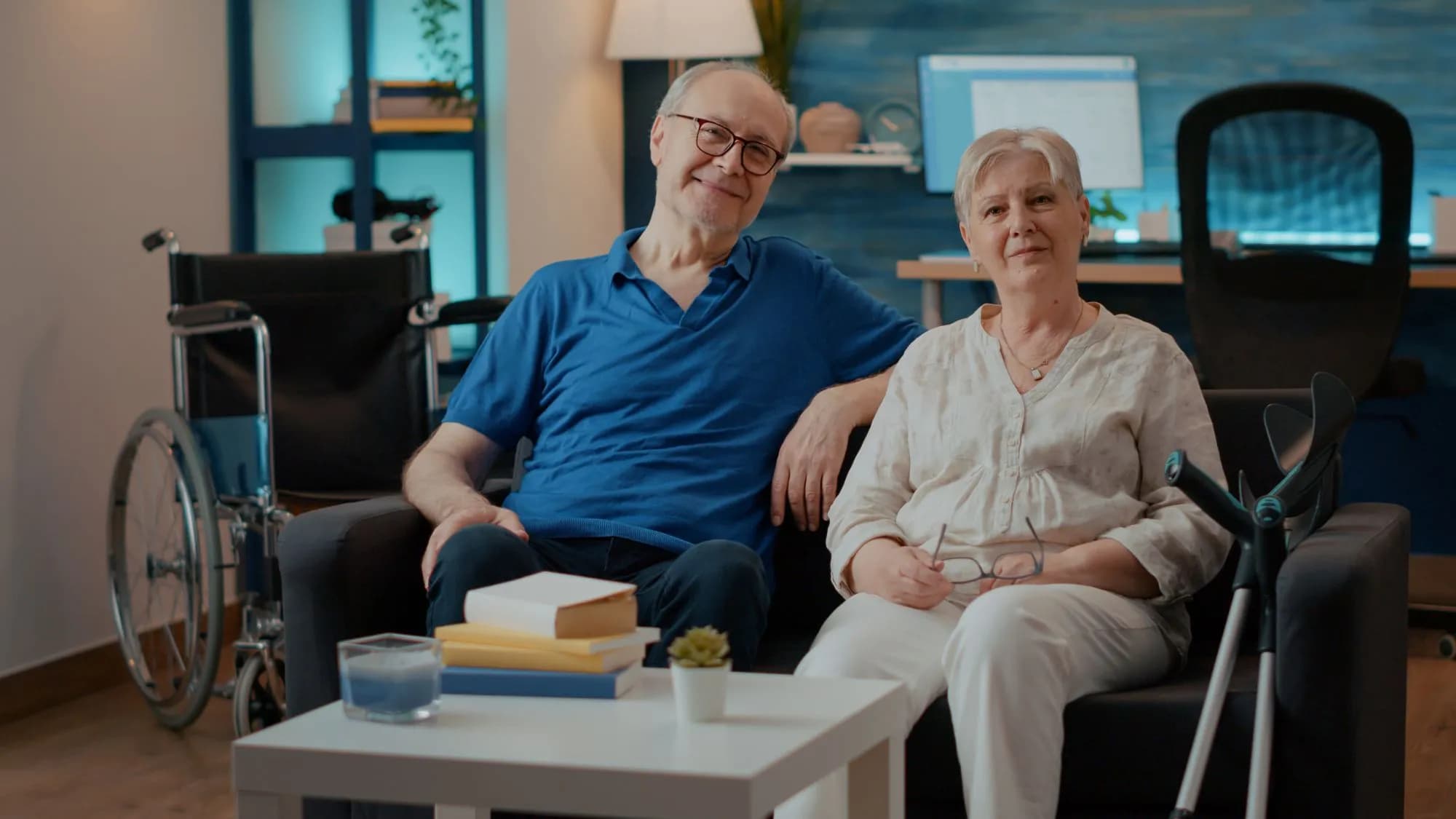 Senior couple sitting together in their home